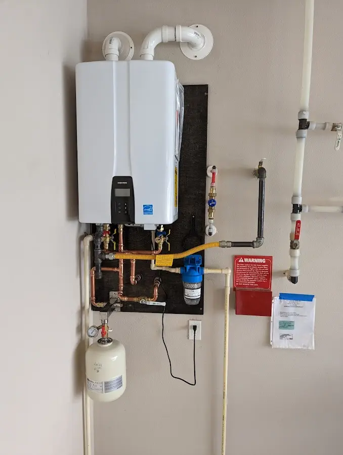 Professional plumber installing copper piping in a Ivins home